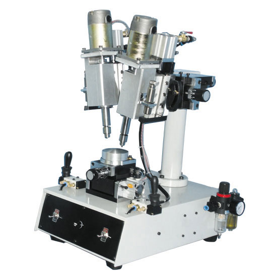 Pneumatic lens drilling machine